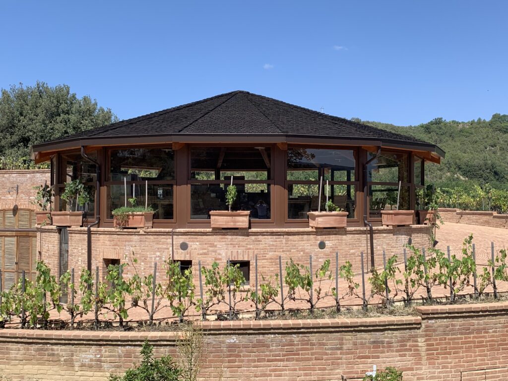 Roger Bissell exploring Italian wine and food at the Podere Le Ripi winery in Montalcino